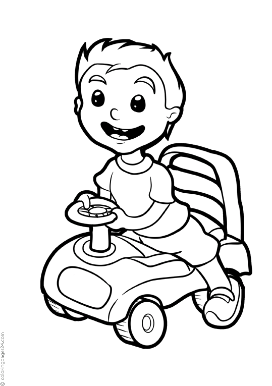 A little boy runs a toy car